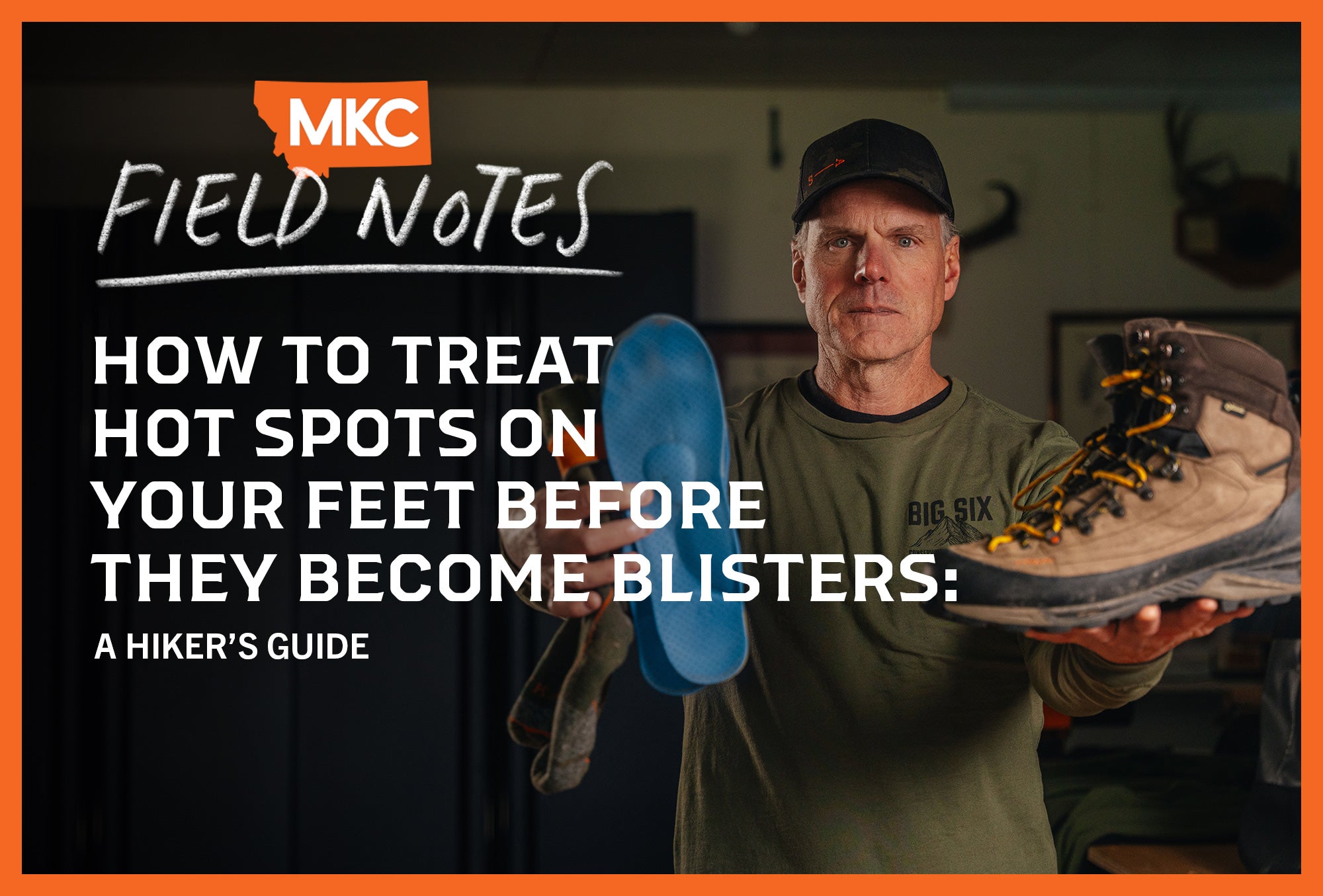 Man holding a hiking boot and its insole, preparing his feet to prevent hot spots and blisters.