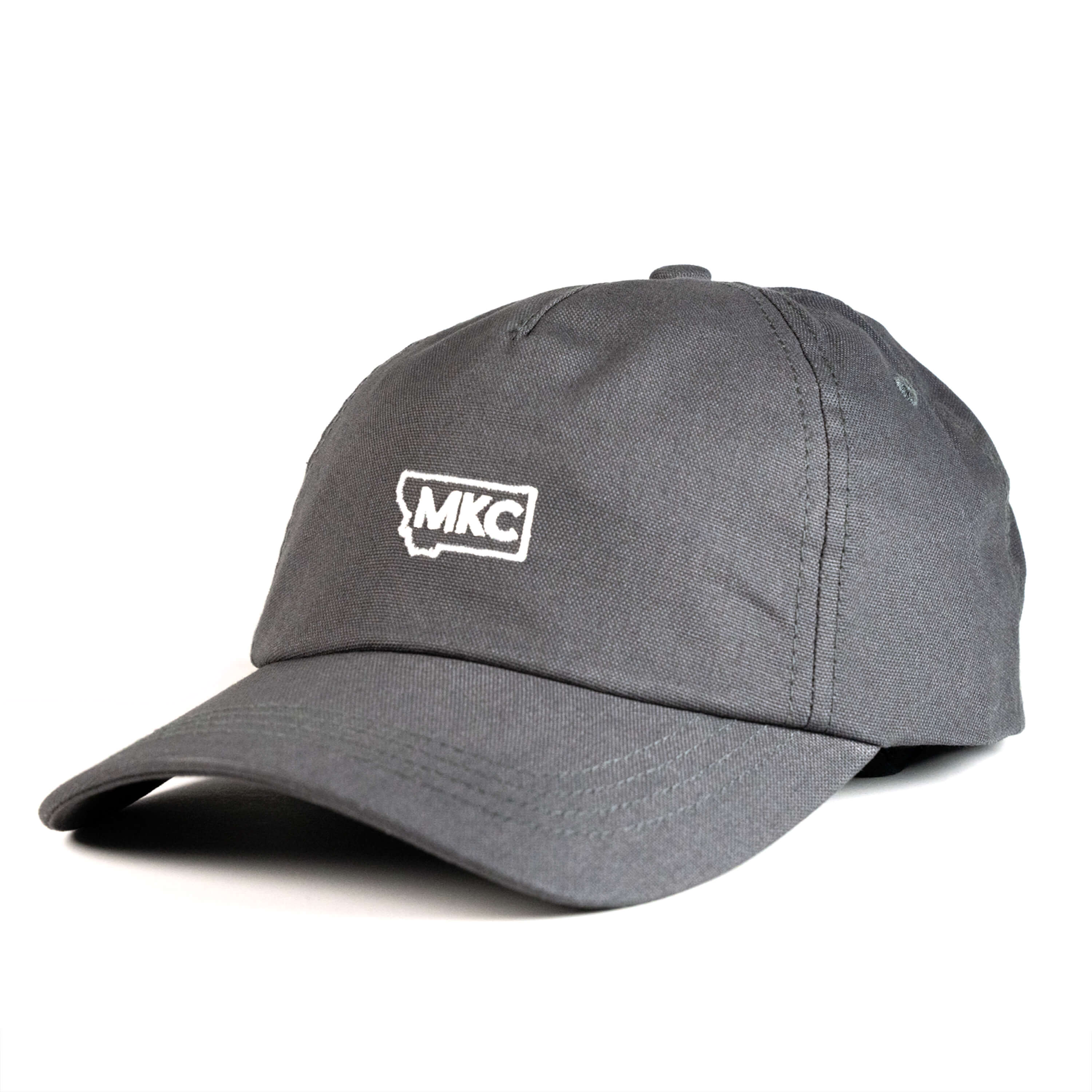 Grey canvas dad hat featuring the MKC logo, designed for outdoor enthusiasts and everyday wear.