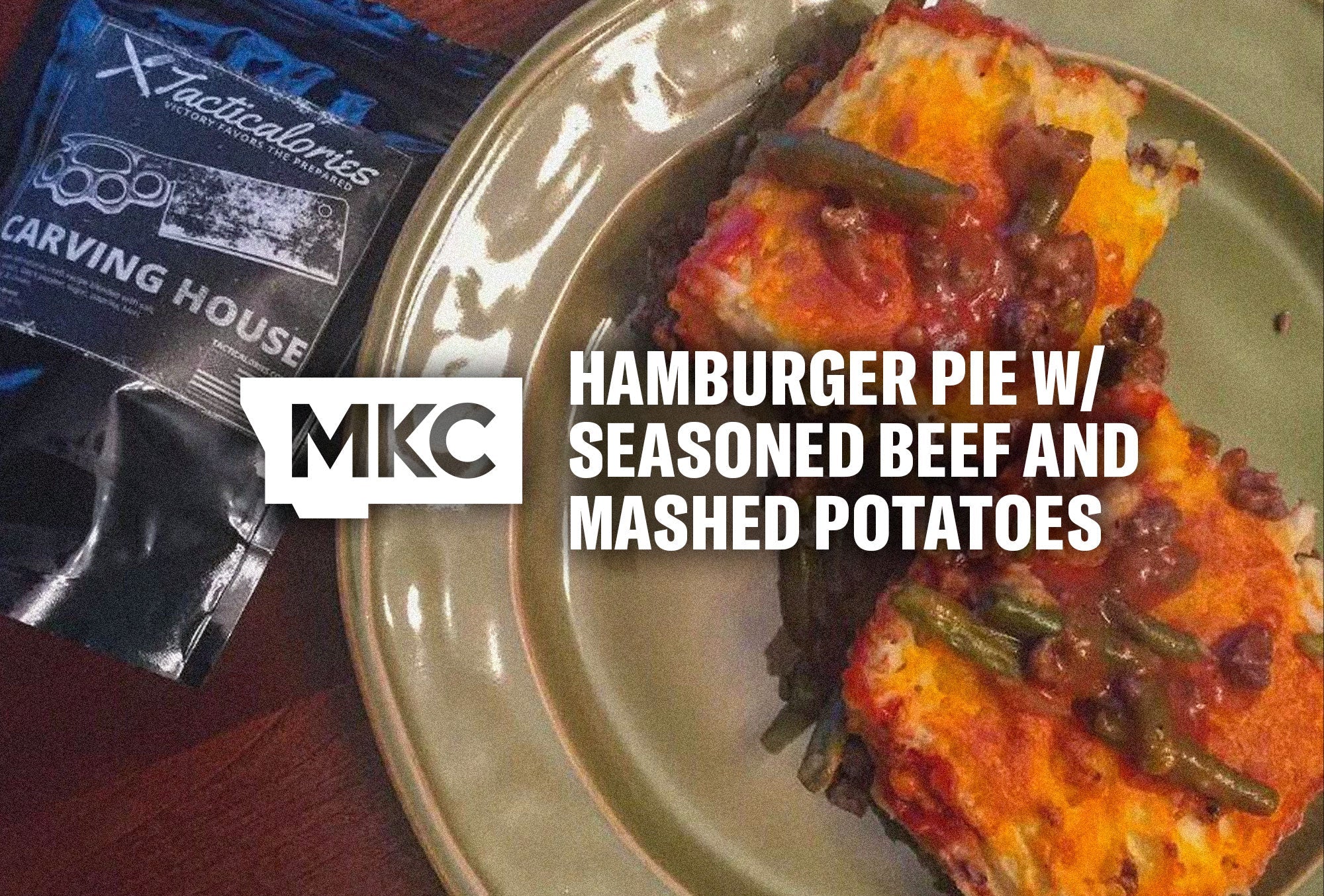 Close‑up of hamburger pie showing layers of beef, green beans, mashed potatoes, and melted cheese on a plate.