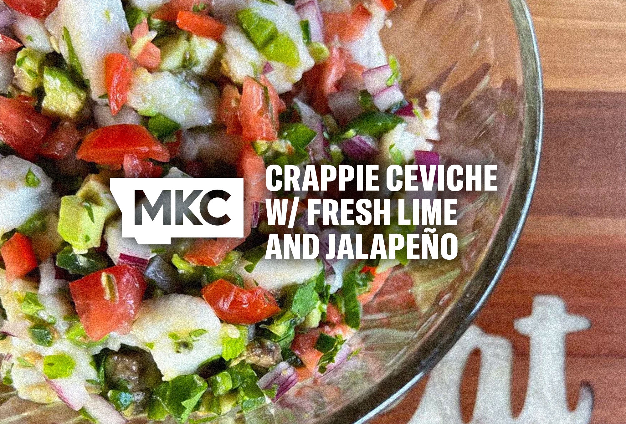 Crappie ceviche featuring lime‑marinated fish mixed with jalapeño, red onion, tomato, and avocado.