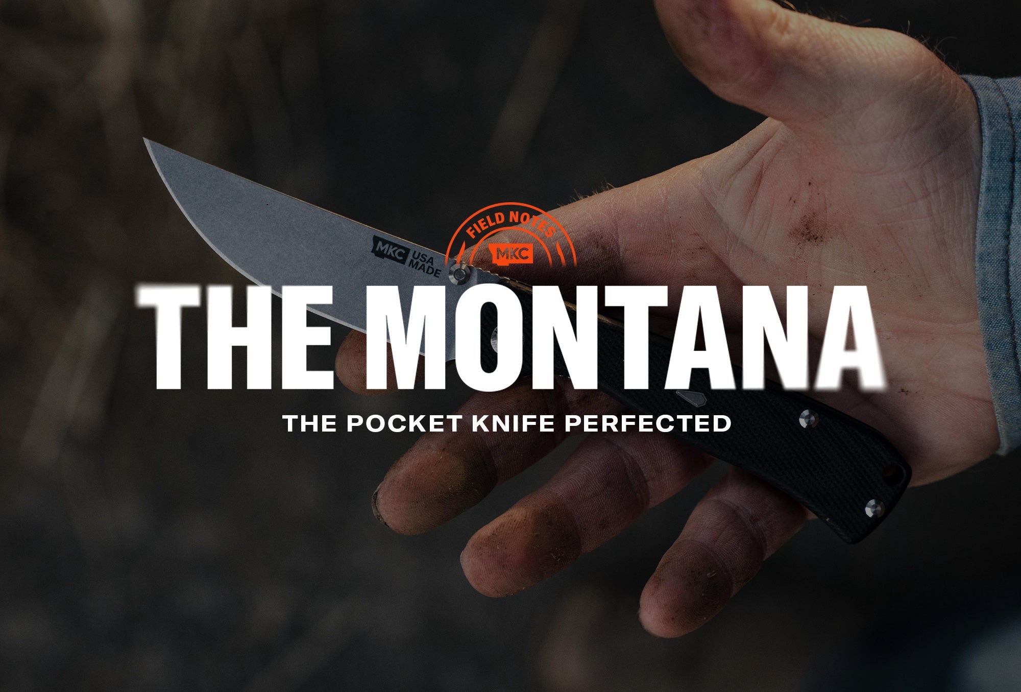 The Montana folding knife held in a worker’s hand, blade open and marked MKC USA MADE.