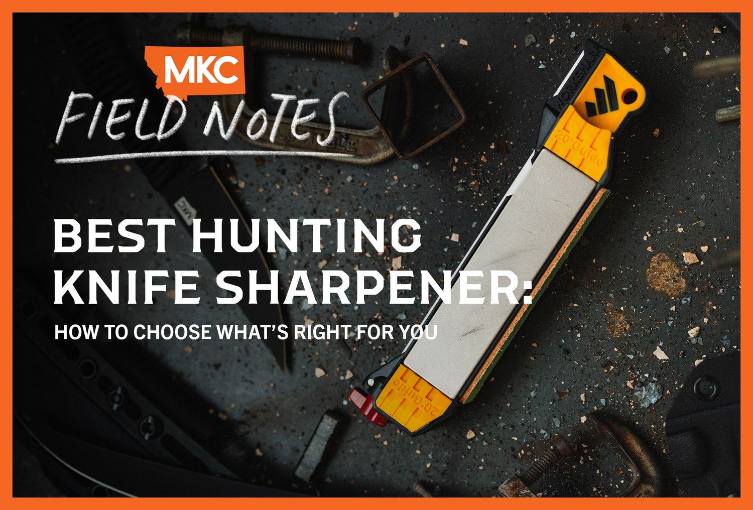 A knife sharpener with yellow grips on a dark workbench surface.