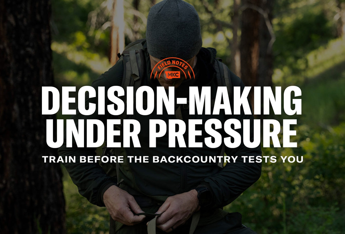 Person adjusting a backpack strap in a forest, wearing a dark jacket and gray beanie, contemplating decision-making under pressure.