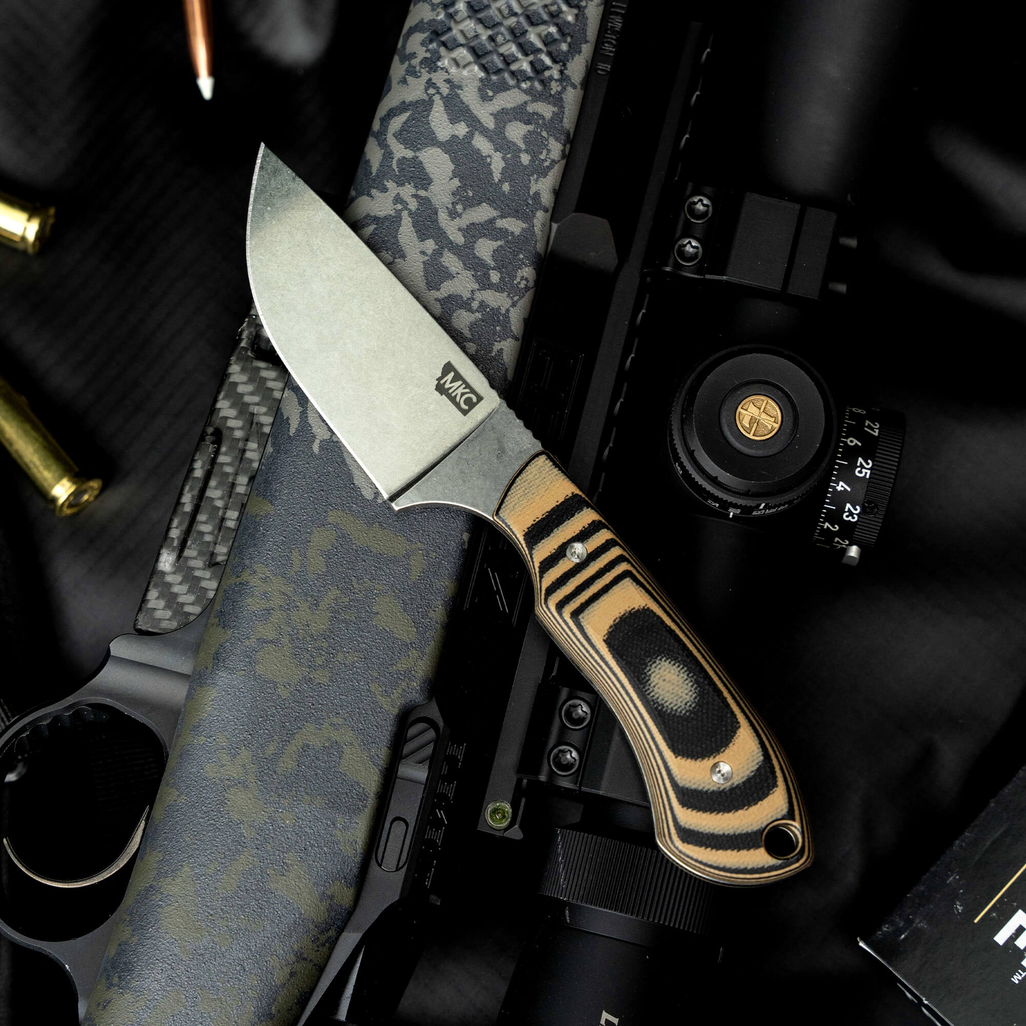 Montana Knife Company's LIVE WILD Elk Knife features a rugged blade and a textured handle, ideal for outdoor enthusiasts.